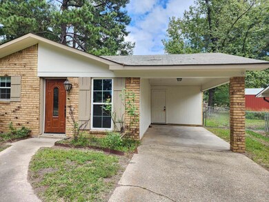 View of front of house featuring a carport