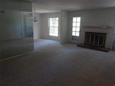 Gas fireplace in living room, doors to deck
