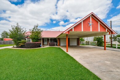 This is the 1825 SF main home with a low maintenance metal roof and a private driveway with a wonderful carport for additional covered parking.