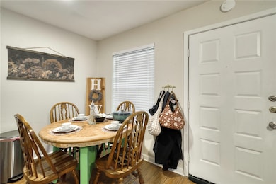 Dining space with wood finished floors