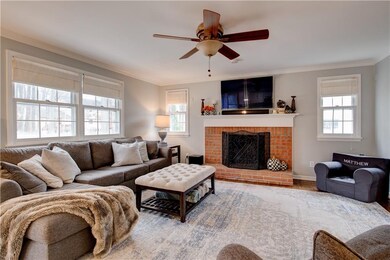FAMILY ROOM WITH WOOD BURNING FIREPLACE