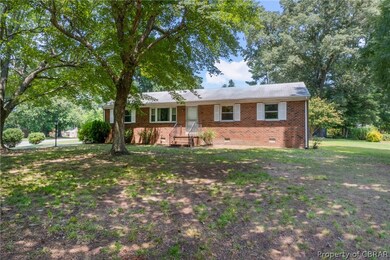Single story home with a front lawn