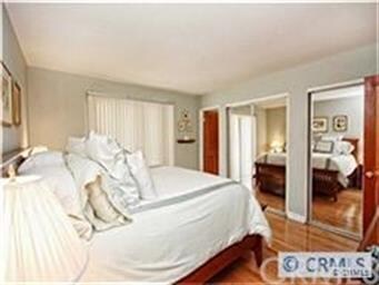Master bedroom with sliders to back yard