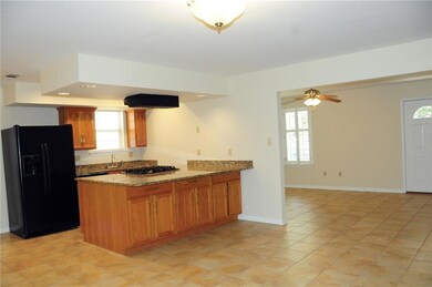 Breakfast bar convenient to kitchen area.