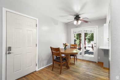 Dining room featuring light wood-style flooring and ceiling fan