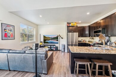 Kitchen featuring stainless steel appliances, ligh