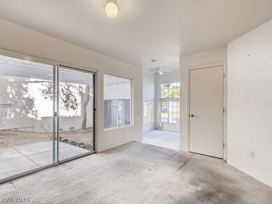 DINING AREA OFF KITCHEN LOOKS OUT ONTO FENCED IN S