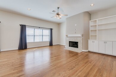 Living room with fireplace and built-ins