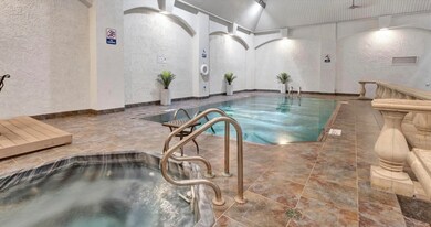 View of pool featuring sink and a jacuzzi