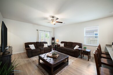 Step into the light and bright family room and you