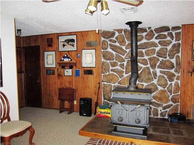 Livingroom has wood-burning stove for cozy evening