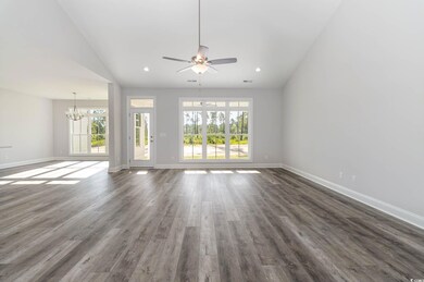 Unfurnished living room featuring lofted ceiling, 