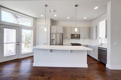 Kitchen featuring visible vents, a kitchen island