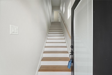Private entry with interior stairs leading to seco