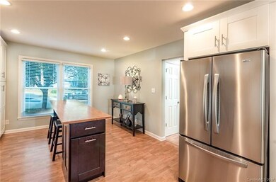 Eat in kitchen island with hidden storage.