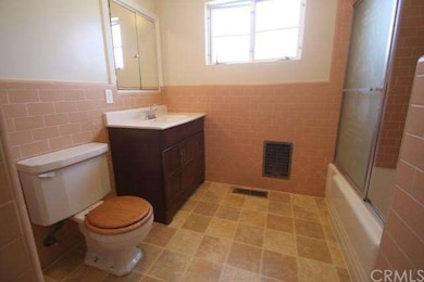 Full bath with new flooring and cool original Rivi