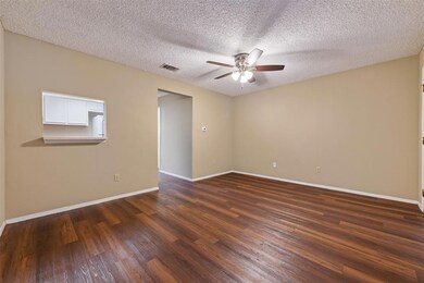 Spare room featuring a ceiling fan, baseboards, d