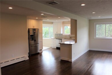 Open concept living, dining, and kitchen.