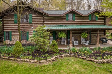 Spacious Country Living in this Unique Log Style H