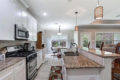 Another view of kitchen overlooking living area.