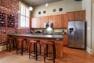 The stylish kitchen has European cabinets, stainle