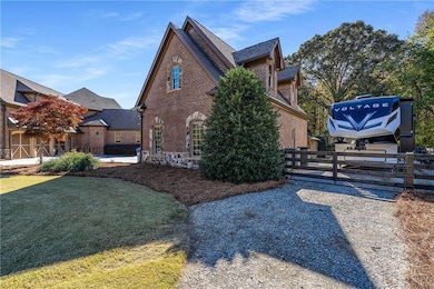 View of 2-car detached garage with workshop and unfinished upper level for future expansion