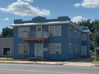 View of front of property featuring a balcony