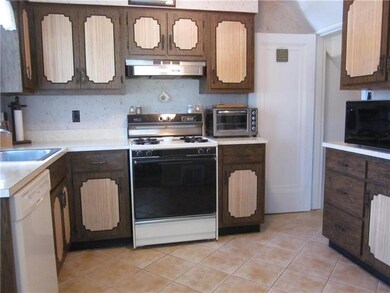Ceramic tile kitchen with appliances and access to