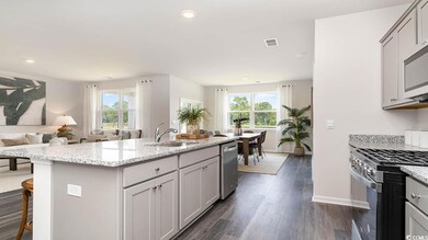 Kitchen featuring a breakfast bar, sink, a center 