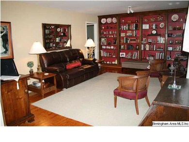 LIVING ROOM FEATURES BUILT-IN SHELVES, HARDWOOD FL
