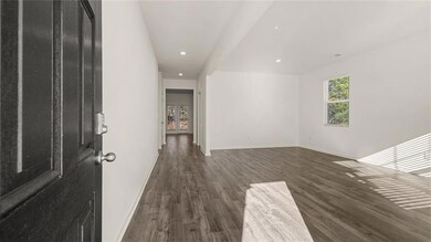 Unfurnished room with recessed lighting and dark wood finished floors