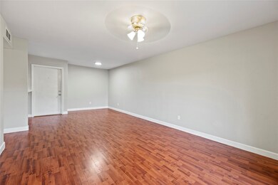 This living area is a large space with a comfortab