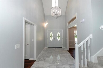 Bright, beautiful foyer with skylight.
