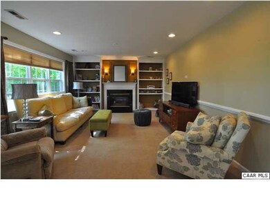 Family room is open to kitchen and features built 