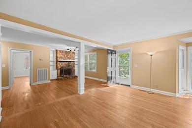 Generous space. Note built-ins on either side of fireplace.