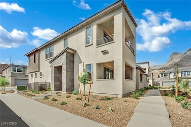 Modern home featuring stucco siding, a balcony, and a residential view