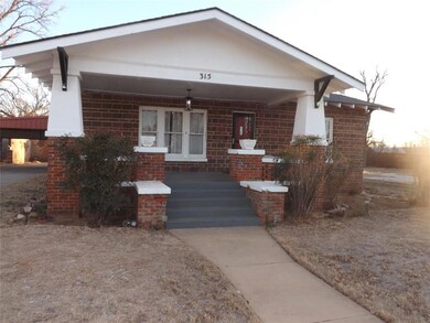 View of front of property featuring covered porch 
