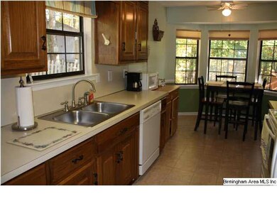 Kitchen has good cabinet and counter space! New fl
