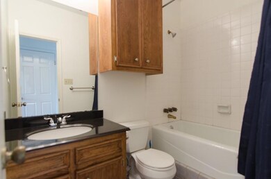 Bathroom with shower / bath combo with shower cur