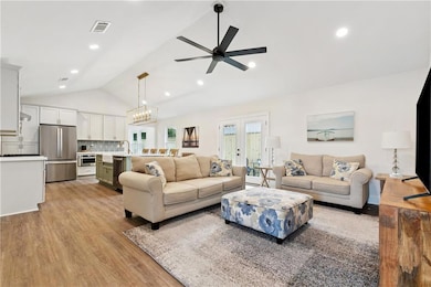 Open Concept Den and Kitchen with Vaulted Ceilings