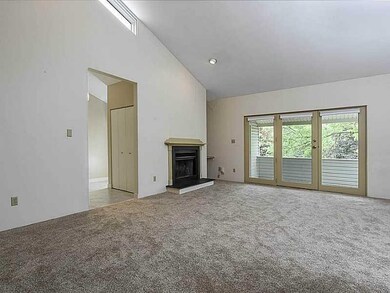 Living Room. This condo has high vaulted ceilings.