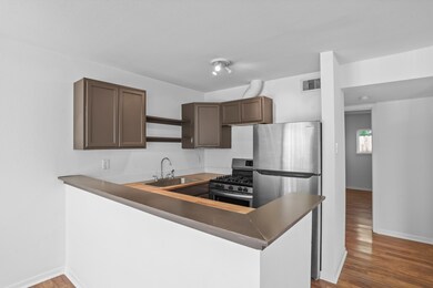 Recently updated kitchen includes cabinetry, stain