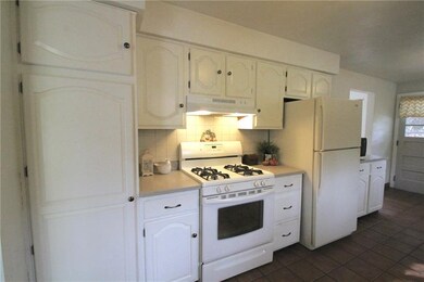 Large eat in kitchen in clean and functional.