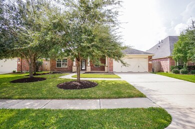 The ADA compliant home offers beautiful curb appeal including classic brick elevation, manicured landscape, and a green front lawn easily watered by the automatic in-ground lawn sprinkler system.