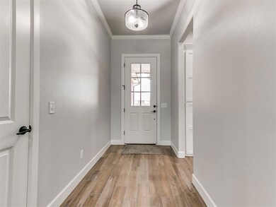 Doorway featuring light wood-type flooring and cro