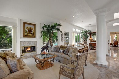 LIVING ROOM AND WET BAR TO SITTING AREA