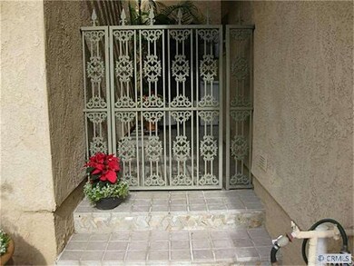 WROUGHT IRON GATE TO ENTRANCE TO COURTYARD