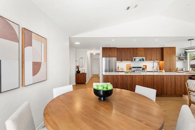 Dining space featuring lofted ceiling and recesse