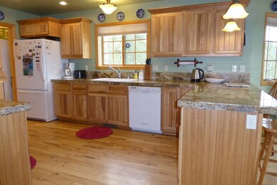 Kitchen With Hickory Cabinets, Granite Tile Counte