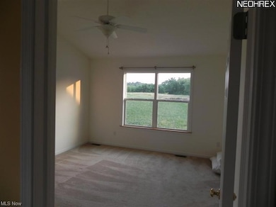 The master bedroom with a vaulted ceiling is spacious enough for the large furniture. Also features a master bath and walk in closet.